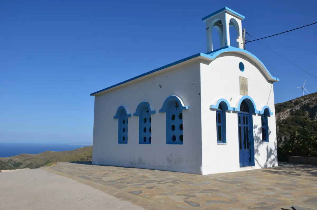small blue and white greek church in the village of kapsouri on evia island