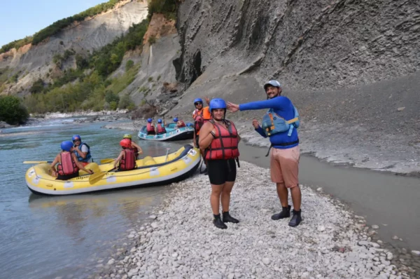 Rafting adventure along the Arachthos River in Ioannina, Greece, featuring colorful rafts and participants in life jackets.