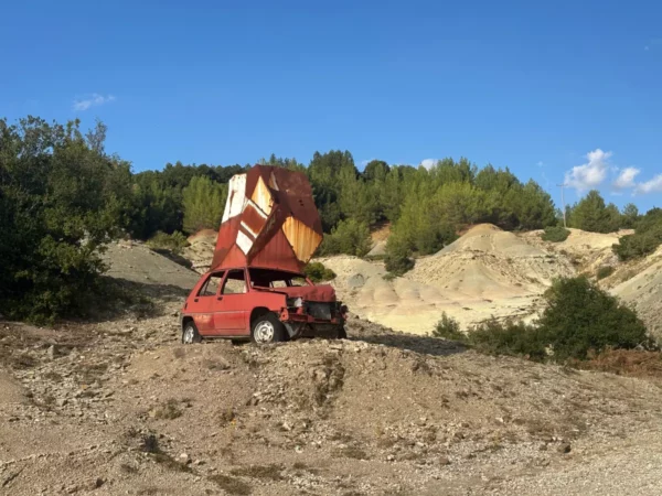 Crushed red-car sculpture from the Theodoros Papagiannis open-air exhibition in Elliniko, Tzoumerka, Epirus, Greece
