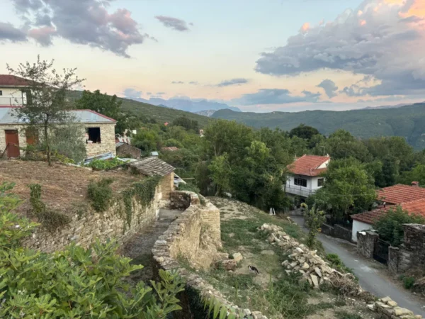 Elliniko village with stone houses and greenery on the slopes of Tzoumerka in Epirus, Greece