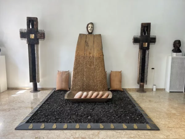 Installation at the Theodoros Papagiannis Museum of Contemporary Art in Elliniko, Tzoumerka — wooden figures, mask, and symbolic objects reflecting Greek rural traditions