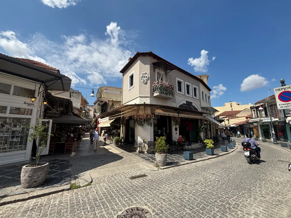 cobbled street with cafés and traditional buildings in the old town of Ioannina, Greece