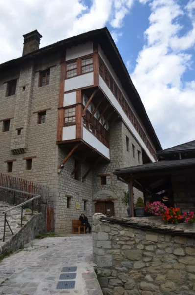 Tositsa Mansion (Metsovo Folk Art Museum), a stone-built 19th-century house with wooden balconies and a cobbled courtyard in Metsovo.