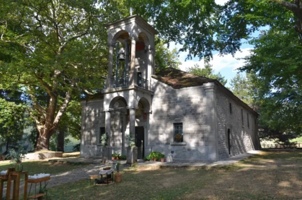 Church of Agios Georgios (Saint George) in the Averof Garden in Metsovo, a small stone chapel surrounded by pines.