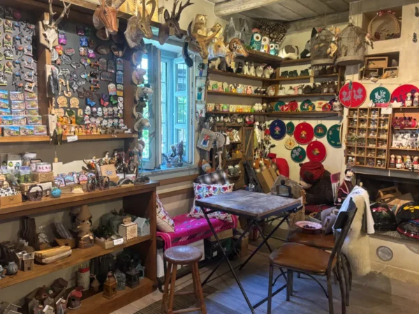 Charming souvenir shop in Papigo, Zagorochoria, Ioannina, Greece, filled with colorful trinkets and local crafts.