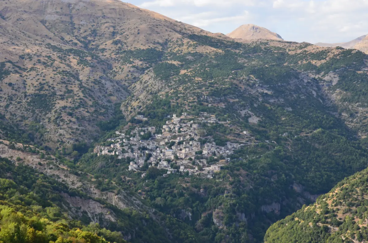 Distant view of Syrrako village clinging to the mountainside in Tzoumerka, Epirus.