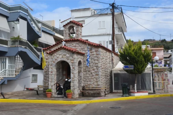 Stone Church of the Holy Trinity in Mantoudi, Evia, Greece, beside the central square.