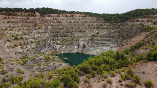 Flooded magnesite quarry lake near Mantoudi, Evia, Greece, surrounded by former terraced mine workings.