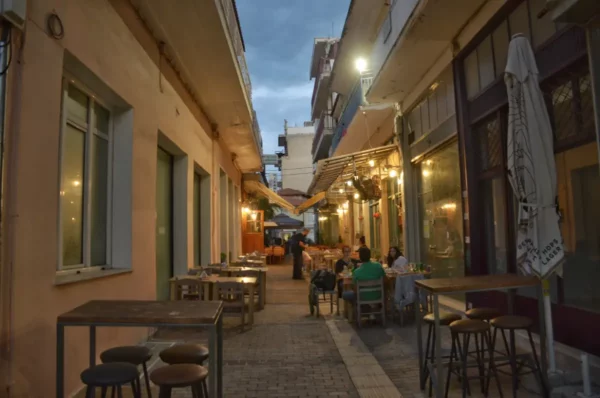 cute narrow street of thebes, greece at night