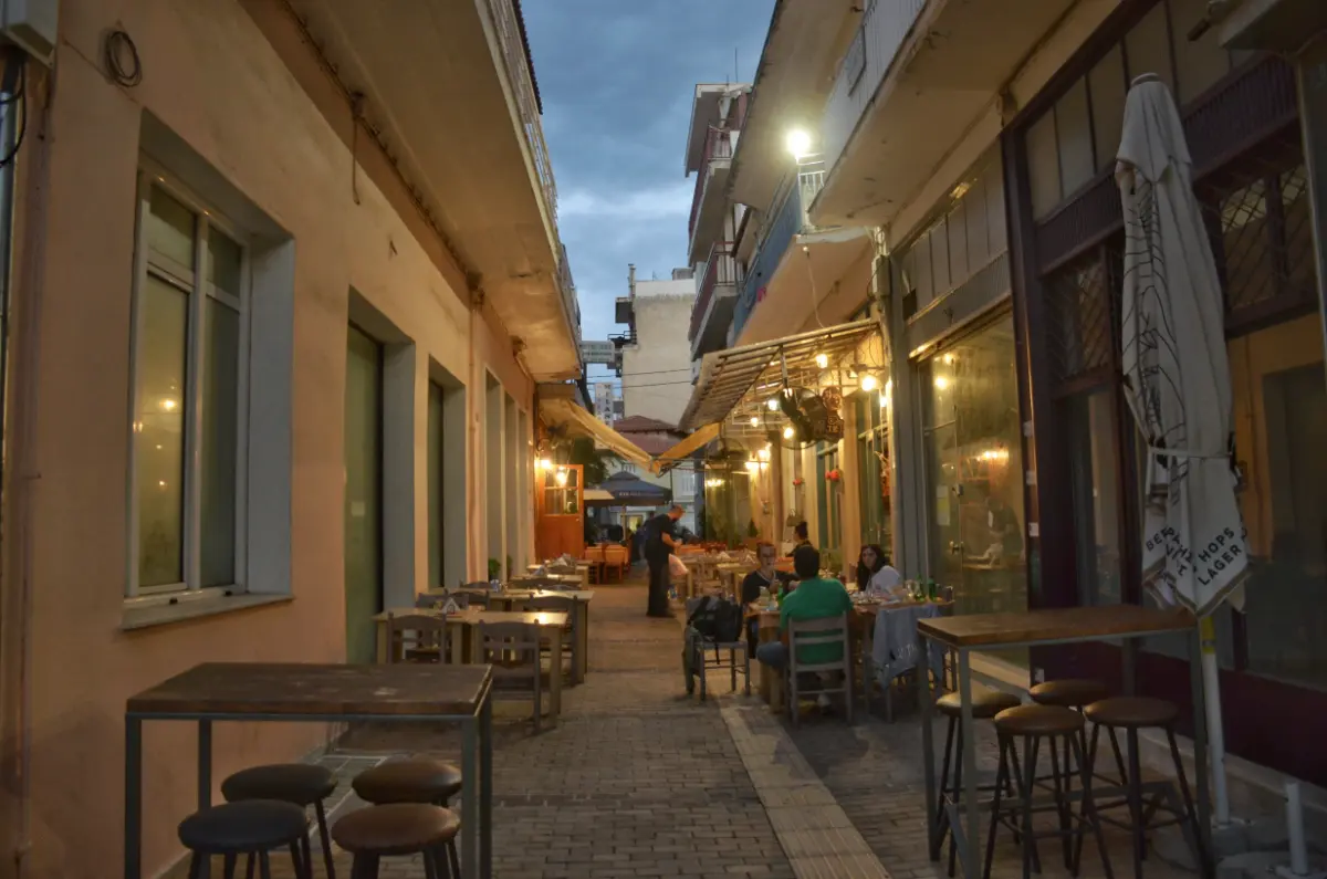 cute narrow street of thebes, greece at night