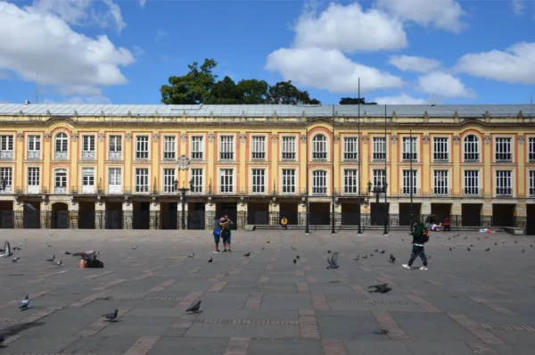 Plaza de Bolívar in Bogotá with pigeons scattered across the square and the historic Liévano Palace in the background
