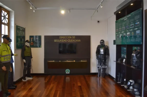 Civic security exhibit with Colombian police uniforms and protective equipment at the Police Museum of Bogotá