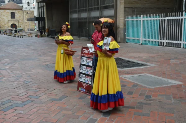 colombian girls dressed in colombian flag dresses in central bogota