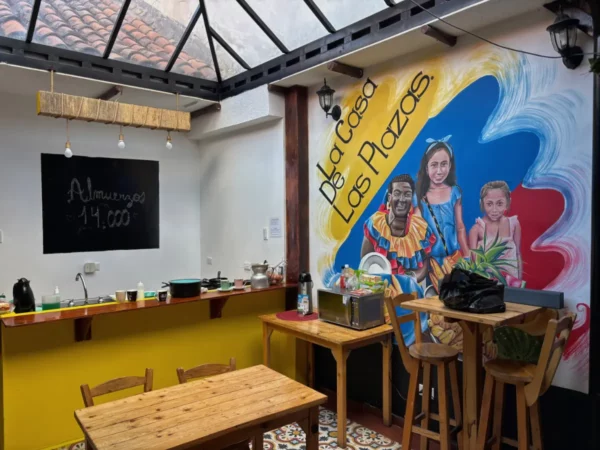 Breakfast area at La Casa de las Plazas guesthouse in Bogotá, Colombia