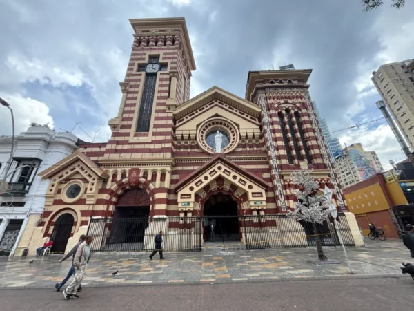 Historic façade of the Church of Our Lady of the Snows in Bogotá, with its distinctive red-and-white striped architecture