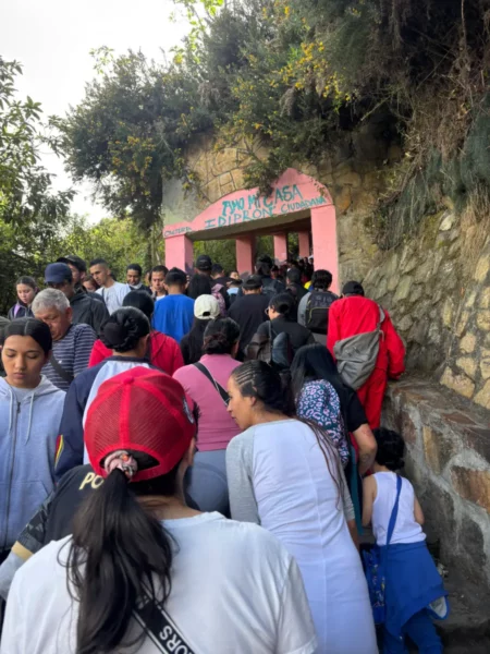 Crowds ascending the Monserrate hiking trail in Bogotá on a busy Sunday morning