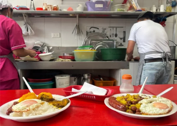 Traditional Colombian lunch served at a small restaurant on Monserrate in Bogotá, with the open kitchen in the background
