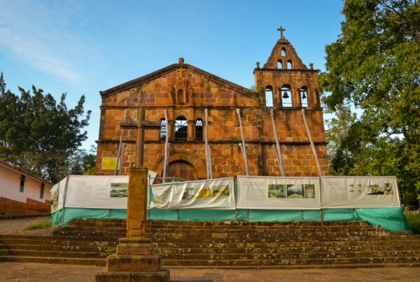 Santa Bárbara Chapel in Barichara, a stone colonial church with a bell tower and steps in front