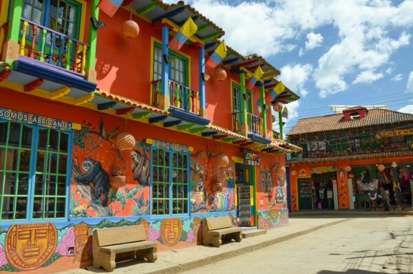 Colorful colonial buildings with painted murals in the center of Ráquira, Boyacá, Colombia