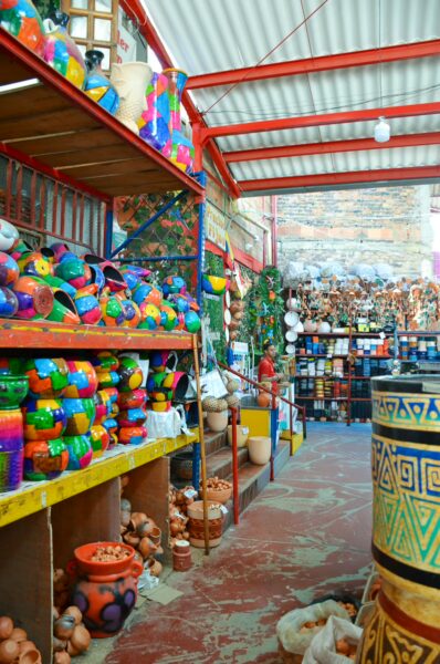 Ceramic pots, vases, and handcrafted decorations inside a pottery shop in Ráquira, Boyacá, Colombia