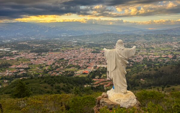 Christ the Redeemer-style statue overlooking Villa de Leyva and the surrounding valley from Mirador El Santo, Boyacá, Colombia