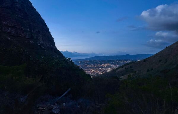 Twilight view of Villa de Leyva illuminated in the valley between mountain ridges, Boyacá, Colombia