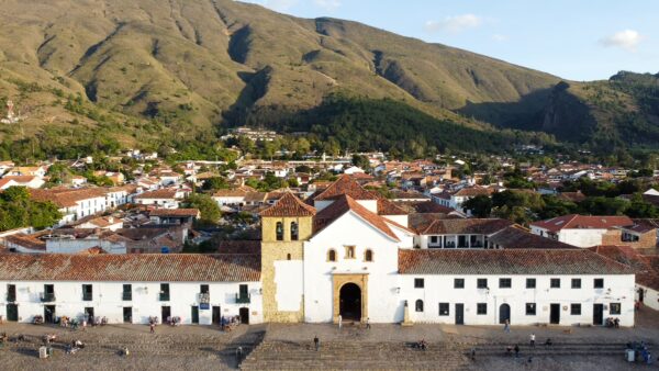 green slopes above Plaza Mayor and the Church of Our Lady of the Rosary in Villa de Leyva, Boyacá, Colombia