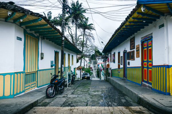 Charming streets of Salento in Quindio, Colombia, showcasing colorful colonial buildings and lush greenery.