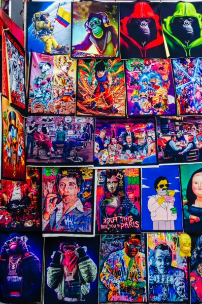 Vibrant street art displays colorful portraits in Comuna 13, Medellín, capturing the area's rich culture and creativity.