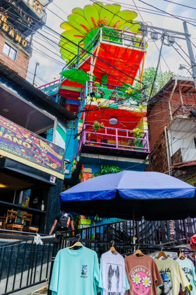 Colorful murals and vibrant structures adorn Comuna 13 in Medellín, highlighting its artistic and lively atmosphere.