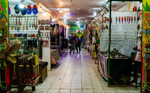 Vibrant artisan market in Leticia, Amazonas, Colombia, featuring colorful crafts, handmade jewelry, and lively stalls.
