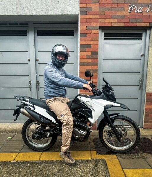 Helmeted rider sitting on a rented dual-sport motorbike in Bucaramanga, ready for a day trip to Chicamocha Canyon