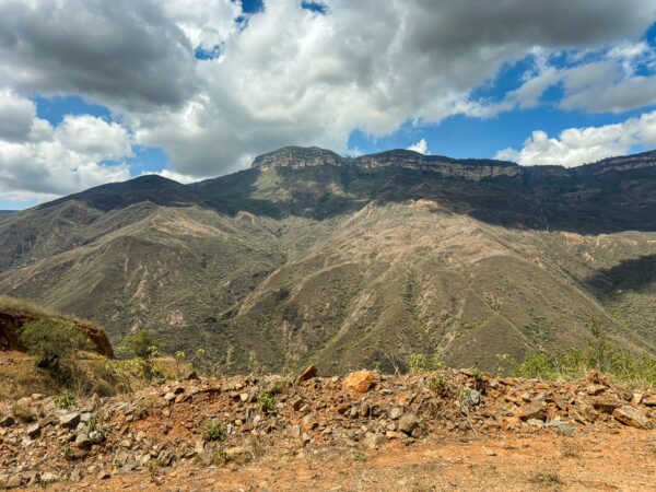 Breathtaking views of Chicamocha Canyon's rugged landscape, showcasing rolling hills and dramatic sky in Santander, Colombia.