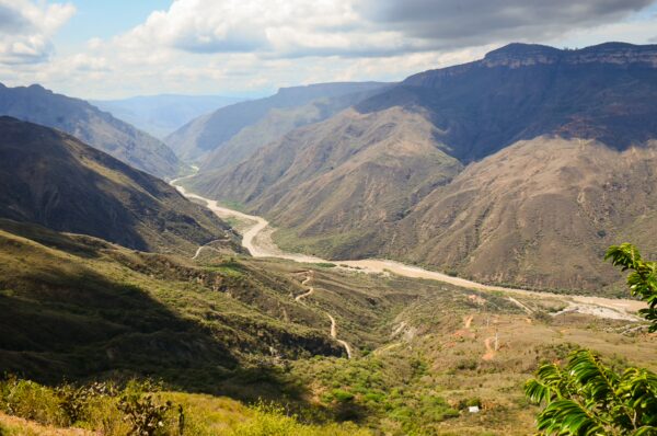 Chicamocha Canyon's expansive valleys and rugged mountains showcase a stunning landscape in Santander, Colombia.