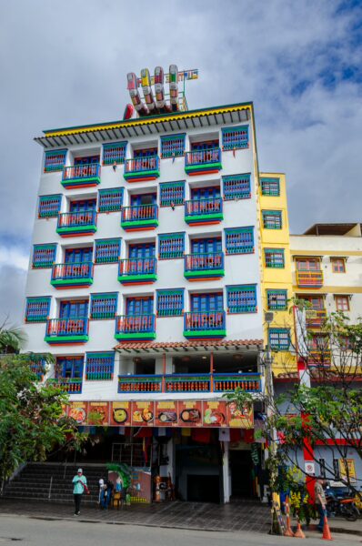 Colorful buildings with vibrant balconies line the streets of Guatapé, showcasing the town's unique architecture and lively atmosphere.