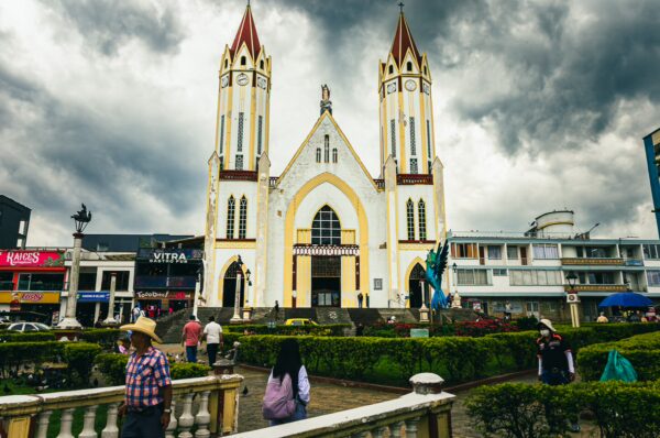Nuestra Señora de las Victórias stands majestically with its twin towers against a dramatic sky in Santa Rosa de Cabal, Risaralda.