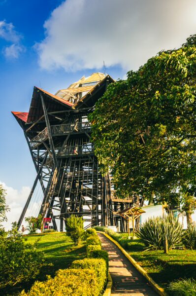 Mirador Colina Iluminada features a striking observation tower surrounded by lush greenery in Filandia, Quindío, Colombia.