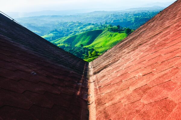 Stunning view from Mirador Colina Iluminada, showcasing lush green hills of Filandia, Quindio, Colombia under a bright sky.