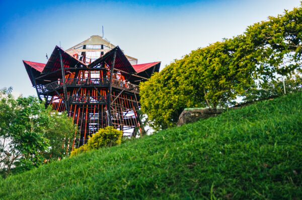 Mirador Colina Iluminada showcases a vibrant observation tower surrounded by lush greenery in Filandia, Quindío, Colombia.