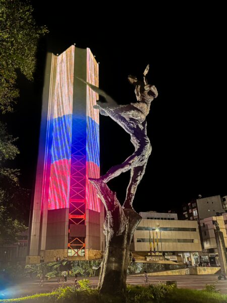 Sculpture illuminated at night with vibrant colors outside the Gobernación de Quindío in Armenia, Quindío, Colombia.