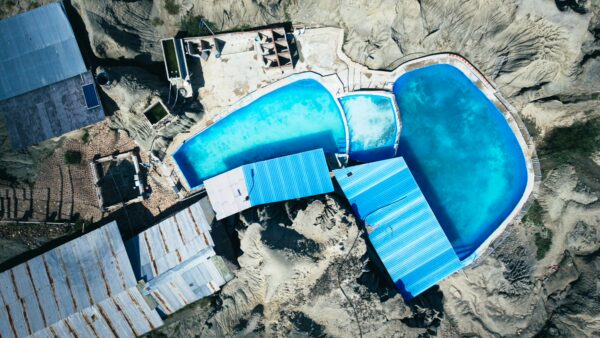 Bright blue pools contrast against the arid landscape of Los Hoyos in the Tatacoa Desert, Huila, Colombia.
