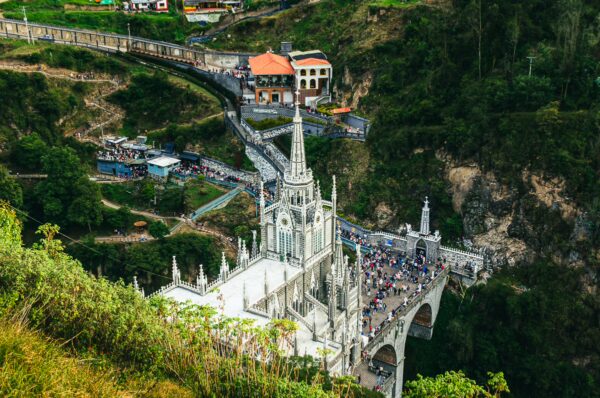 Stunning view of the Las Lajas Sanctuary in Narino, Colombia, featuring intricate architecture and surrounding lush greenery.