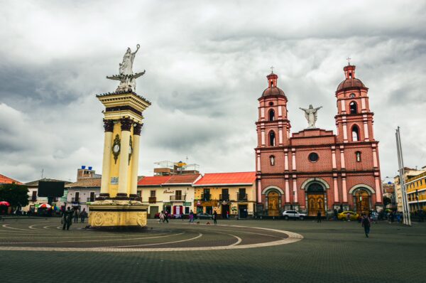 Historic 20 de Julio Park features a grand monument and the striking pink twin churches in Ipiales, Nariño, Colombia.