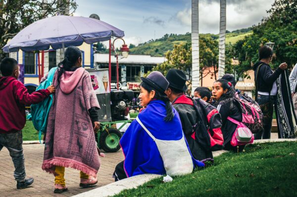 Captivating scene at Parque Principal Silva in Cauca, Colombia, featuring colorful traditional garments and lively market activity.