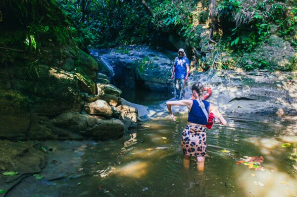 Natural pool at Piscina Natural Pachenda in Ladrilleros, Valle del Cauca, Colombia, with lush greenery and calm water.