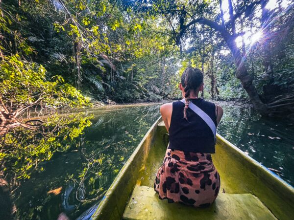 Paddle through lush greenery beside tranquil waters at Piscina Natural in Pachenda, Ladrilleros, Valle del Cauca, Colombia.