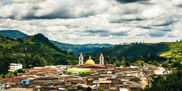 Belen Hill offers a stunning view of the valley, showcasing the vibrant town below and its prominent cathedral in Cauca, Colombia.
