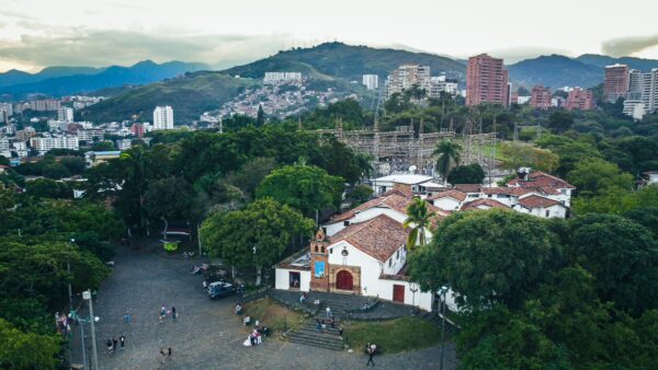 Colina de San Antonio showcases a charming church surrounded by lush greenery and cityscape at twilight in Cali, Valle del Cauca, Colombia.