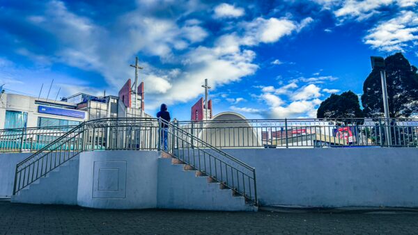 Stairs leading up to a domed structure under a vibrant blue sky, Parque Ayora in Tulcán, Ecuador.