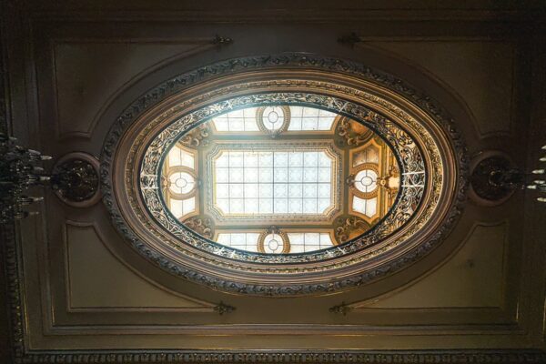 Elegant oval skylight featuring intricate detailing and ornate architecture inside the art museum in Craiova, Romania.
